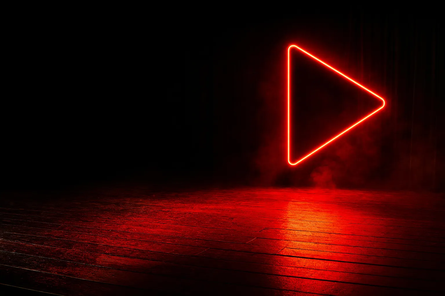 Neon play symbol on a red-lit stage